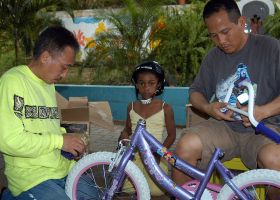 Fixing a bicycle for a child in Panama – Best Places In The World To Retire – International Living